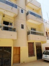 A vendre un immeuble R+2 à Ouest foire (ref sleye)